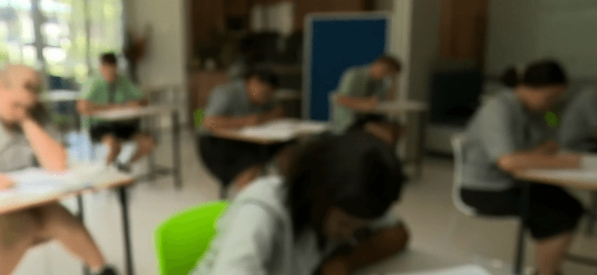 Youth learning in a classroom workshop